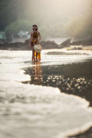 Pretty woman relaxing at tropical beach. Remote tropical beaches and countries. Travel concept.の写真素材