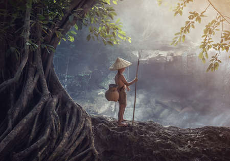 Boy fishing at the creek, Thailand countrysideの写真素材