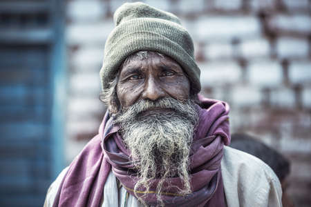 VARANASI, INDIA - February 23,2018: Portrait of Shaiva sadhu, holy man on the ghats of the Ganges...