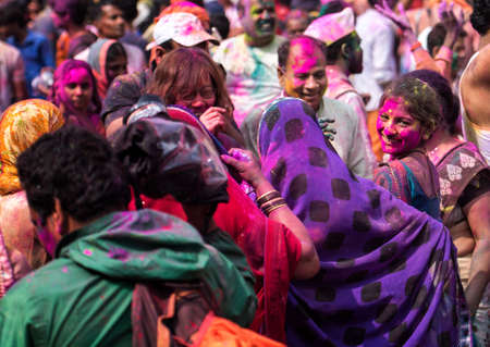 MATHURA, INDIA - Feburary 25,2018: Man takes selfie and have fun in colors during traditional holi festivalのeditorial素材