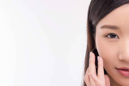 Beautiful Young Woman with Clean Fresh Skin. Face care . Facial treatment . Cosmetology , beauty and spa. Asian women portraitの写真素材