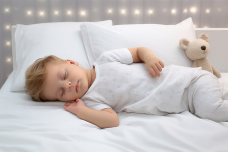 Newborn sleeping on the white bed, New family and baby protection conceptの素材
