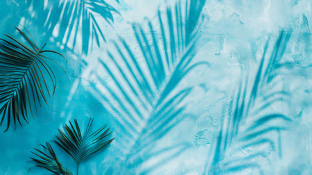 Empty palm shadow blue color texture pattern cement wall background. Used for presentation business nature organic cosmetic products for sale shop online. Summer tropical beach with minimal conceptの素材