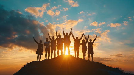 Teamwork and success concept, Silhouette of business people on the top of the hillの素材