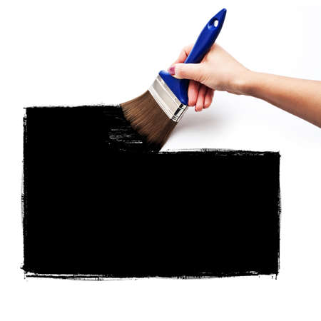 On a white wall with a brush paint a black squareの写真素材