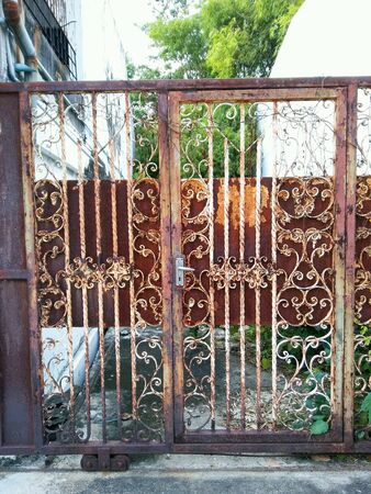 Old rusty metal doors close up view.の素材