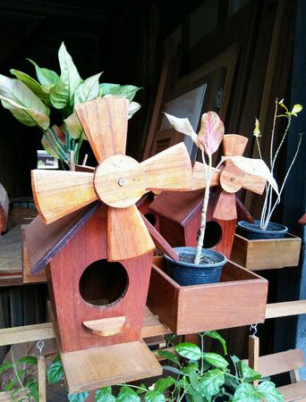 Wooden bird house on shopping street.の素材