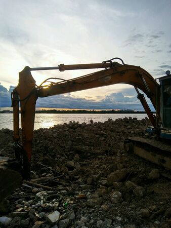 Excavator and river viewの素材