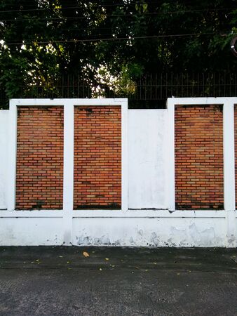 Red bricks in the white wall.の素材