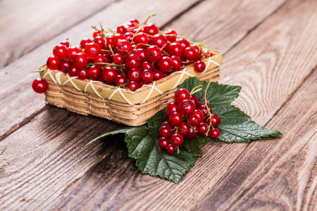 Fresh currants on wooden backgroundの写真素材