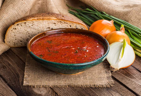 Ukrainian beetroot soup - borscht, on napkin, on wooden backgroundの写真素材