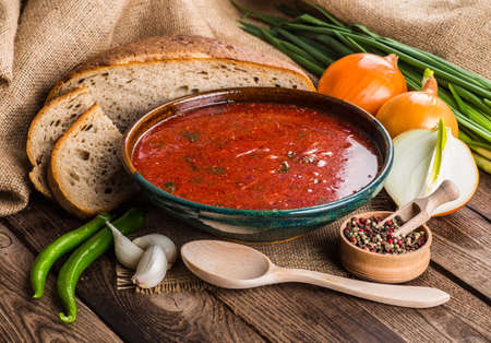 Ukrainian beetroot soup - borscht, on napkin, on wooden backgroundの写真素材