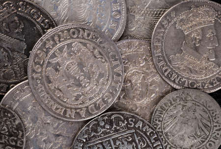 trove of ancient medieval coins silver backgroundの写真素材