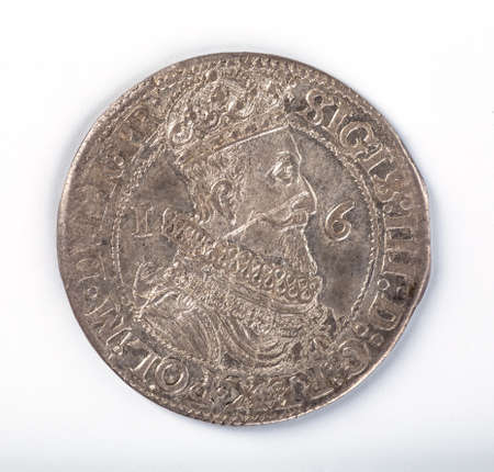 Antique silver Polish coin. King Sigismund III Vasa. Obverse. Isolated on whiteの写真素材