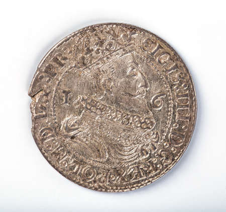 Antique silver Polish coin. King Sigismund III Vasa. Obverse. Isolated on whiteの写真素材