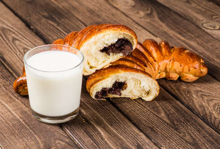 Tasty croissants with spikelets on grey wooden backgroundの写真素材