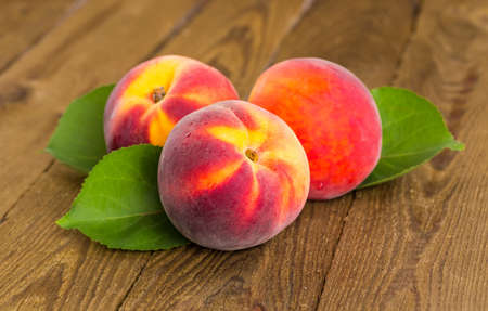 fresh peaches on wood backgroundの写真素材
