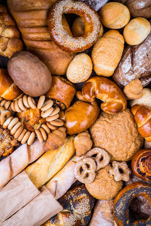 fresh bread and wheat on the woodenの写真素材