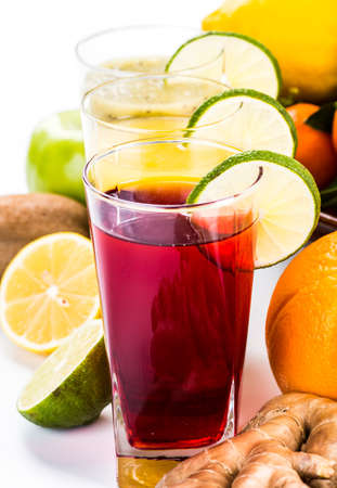Fresh fruits and juice isolated on white backgroundの写真素材