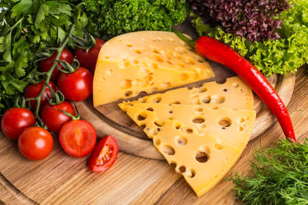 Cheese board - various types of soft and hard cheese. International dairy delicacies.の写真素材