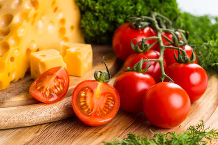 Cheese board - various types of soft and hard cheese. International dairy delicacies.の写真素材