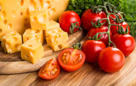 Cheese board - various types of soft and hard cheese. International dairy delicacies.の写真素材