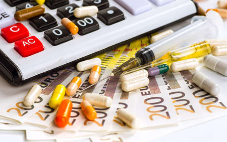 Stethoscope, pills and bottles on color background. medicine conceptの写真素材