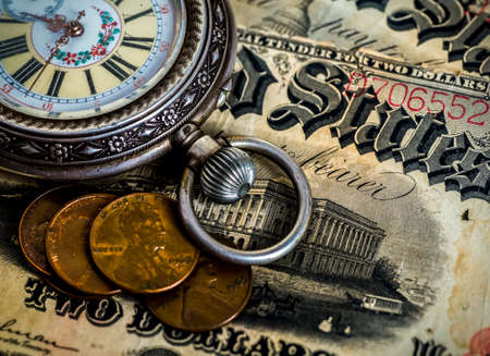 Vintage pocket watch on musical notesの写真素材