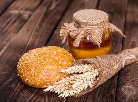 Assortment of baked bread on wooden table backgroundの写真素材