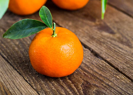 Fresh oranges on a wooden table