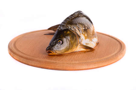 Fresh raw fish and food ingredients on tableの写真素材