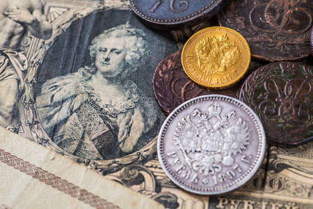 Gold and silver coins of the Russian Empire in the background kopyur.Antikvariat.の写真素材