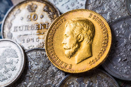 Gold and silver coins of the Russian Empire in the background kopyur.Antikvariat.の写真素材