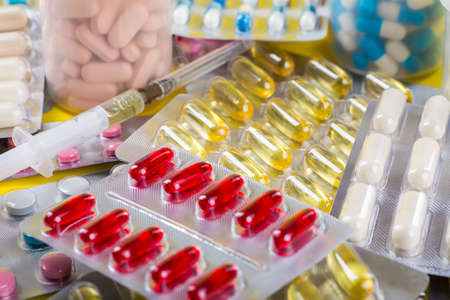 Selection of different pills in form of tablets and capsules