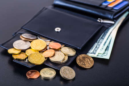 dollars bills in wallet isolated on black