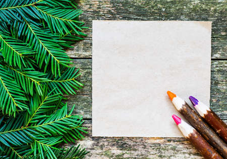 Christmas fir tree with decoration on a wooden boardの写真素材