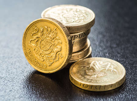 British coins stack on black, pound sterlingの写真素材
