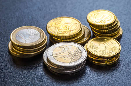 Euro coins. One Euro coin on the foreground.の写真素材