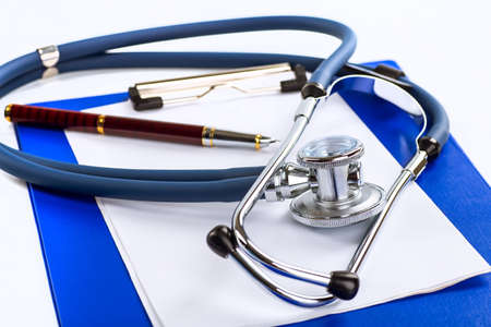 Stethoscope, pills and bottles on color background. medicine conceptの写真素材