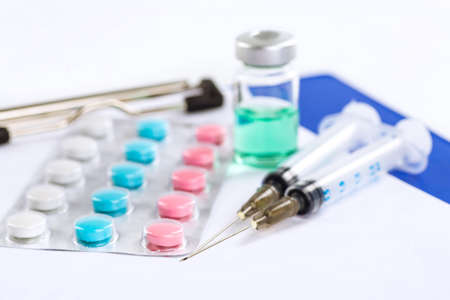 Stethoscope, pills and bottles on color background. medicine concept