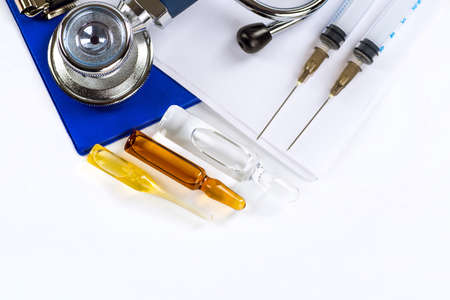 Stethoscope, pills and bottles on color background. medicine conceptの写真素材