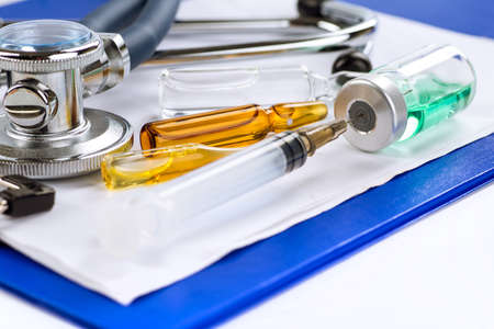 Stethoscope, pills and bottles on color background. medicine conceptの写真素材