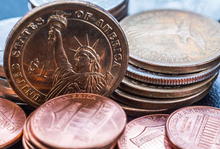 dollar coins stack on blackの写真素材