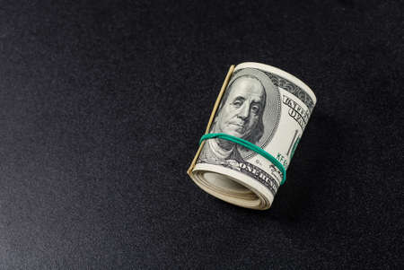 Stack of one hundred dollar bills close-up.の写真素材