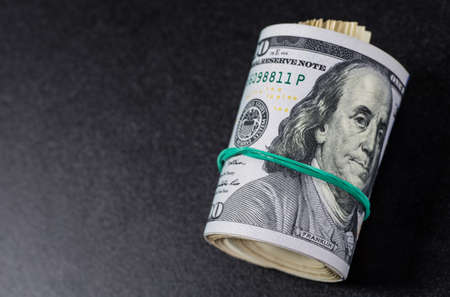 Stack of one hundred dollar bills close-up.の写真素材