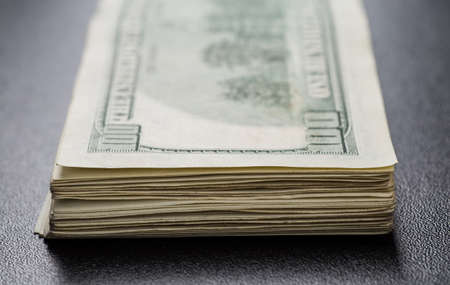 Stack of one hundred dollar bills close-up.の写真素材