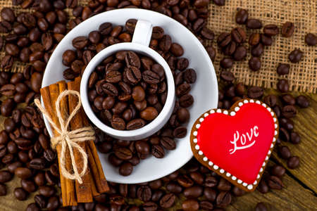 Cup of black tea and heart shaped cookies, for valentine's dayの写真素材