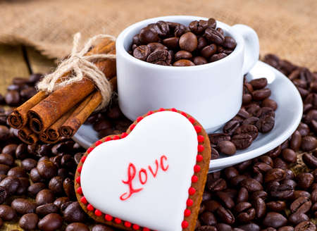 Cup of black tea and heart shaped cookies, for valentine's dayの写真素材