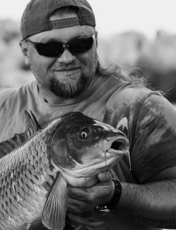 Carp and Fisherman, Carp fishing trophy.の写真素材