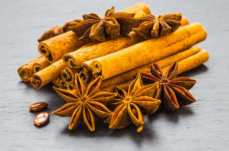 Mulled wine ingredients spices. Anise, cinnamon, cardamom on stone table.の写真素材